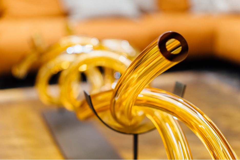 Gold, glass, twisted tube decor