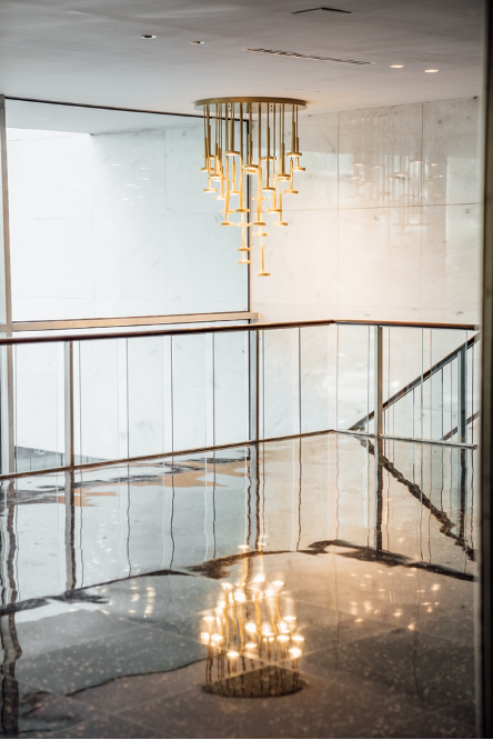 An indoor balcony with a chandelier