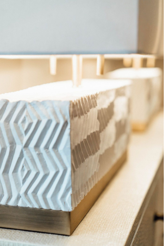A long, rectangular, sculptural and decorative lamp
