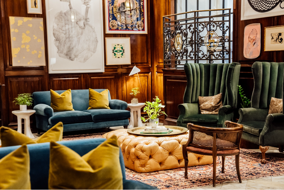 A seating area with chairs and couches
