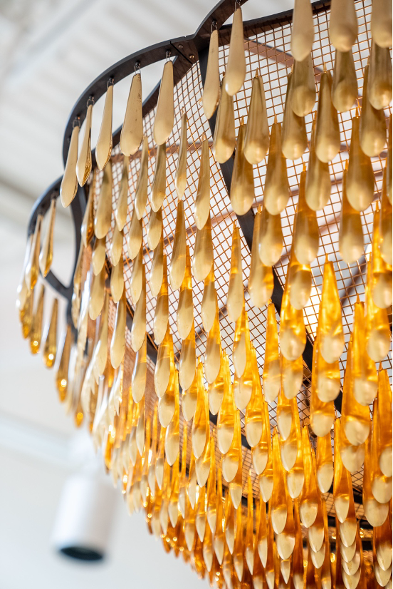 A yellowy gold layered chandelier 