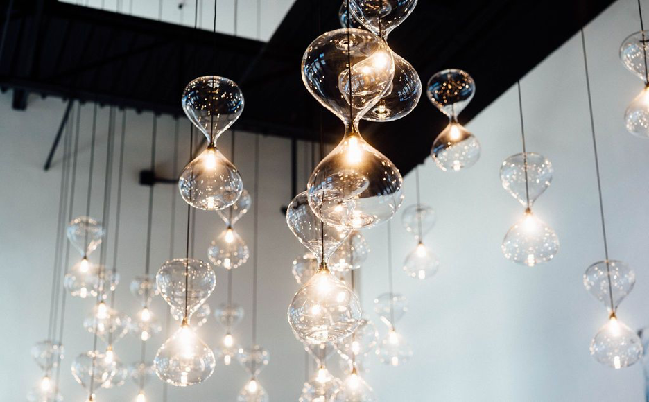 Hourglass shaped lighting hanging from the ceiling